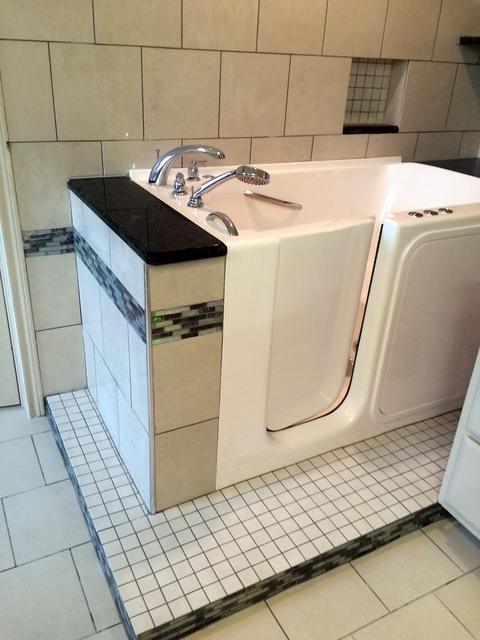 Walk-in tub with tile surround