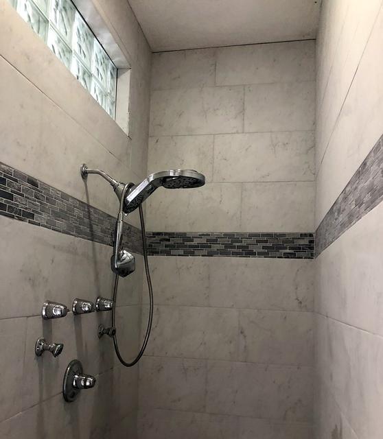 Tile shower with body sprays
